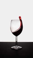 Splashes in a glass of red wine