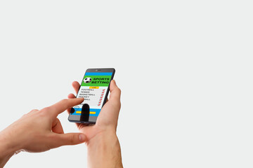 woman holding a mobile phone with sports betting website in the screen.