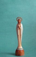 Madonna Statue on Greenish Background