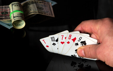 Poker cards with a high card combination. Close up of a gambler hand is holding playing cards in casino