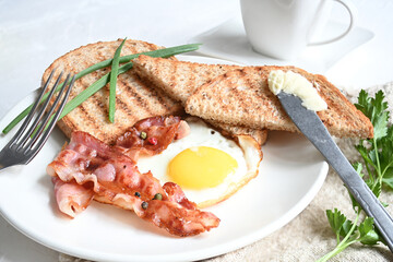 breakfast with fried eggs, toasts, and coffee on white background