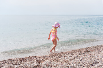 little girl running on the beach