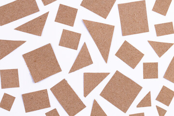 Pattern of simple craft paper shapes isolated on white