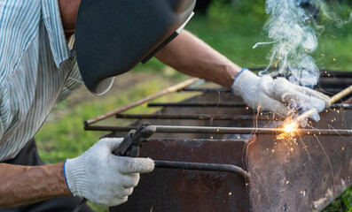 a welder working on the construction of the country