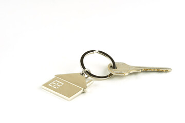 the door key isolated on white background the concept of a home purchase