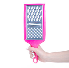 Manual kitchen grater in hand on white background isolation