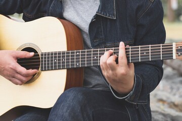 Fototapeta na wymiar musician playing strum acoustic guitar. 