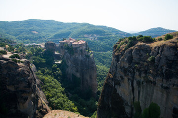 Meteora Mountains and orthodox monastery on top of a hill. Meterora, Greece
