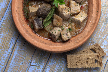Traditional homemade fish tajin stew with potatoes