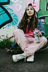 Young gay woman graffiti artist and skater