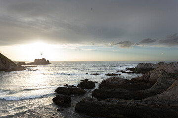 Naklejka na ściany i meble sunset over the sea and cliffs in Asturias