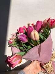 A bouquet of tulips of different colours on a sunny day, share love, present flowers, order flowers online, spring flowers, spring is coming 