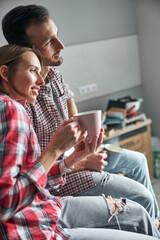 Dreamy young couple enjoying their work break