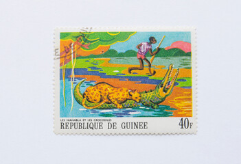 Guinea Republic Postage Stamp. circa 1968. the jaguar and the crocodiles
