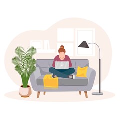 Fototapeta na wymiar The concept of home office. Self-isolation during the coronavirus epidemic. A woman working from home, distance learning sitting on the couch, the concept of remote work. Freelancer. Interior of room.