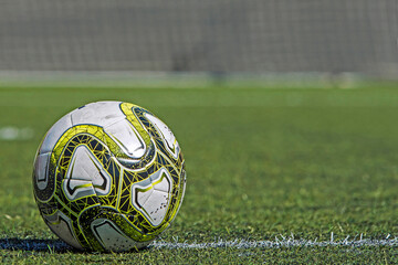 Soccer ball on the artificial grass. © davidpastorandres
