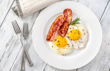 Fried eggs with bacon rashers