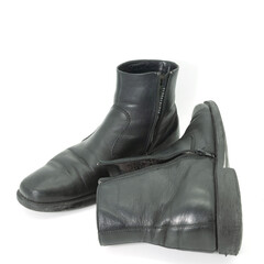 a pair of worn winter ankle boots