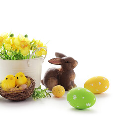 colorful easter eggs and spring flowers isolated on white background