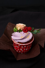 cupcake with berries and rose flowers