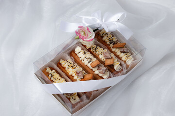 eclairs with chocolate cream and sprinkles