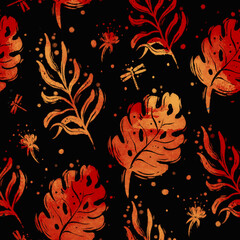 Pattern of tropical yellow leaves on a black background