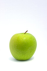 single green Granny Smith apple on white background with copy space