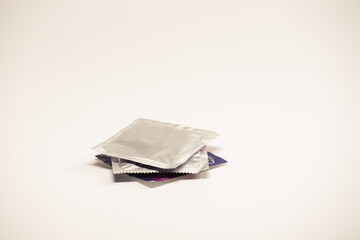 A pile of condoms on the white background