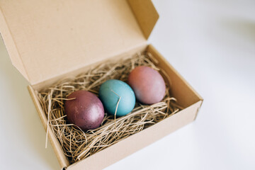 Not standard packed Easter eggs in a cardboard box