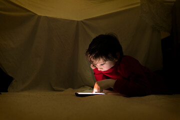 Child watching a smartphone.