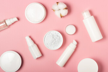 Alginate and clay face masks. Cosmetic products, masks and creams in jars. Top view, flat lay