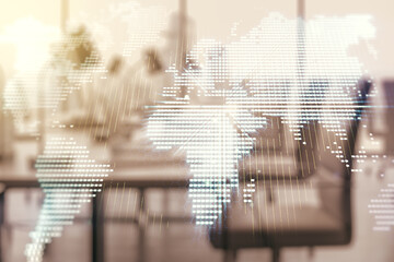 Multi exposure of abstract creative digital world map hologram on modern corporate office...