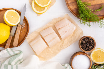 Freshly caught halibut cut into pieces for cooking. Healthy seafood recipe.