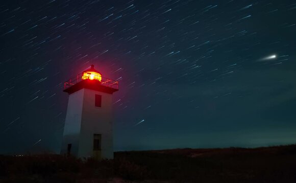 Night Time Lapse with star trails of Wood End lighthouse in Provincetown, Massachusetts, USA.