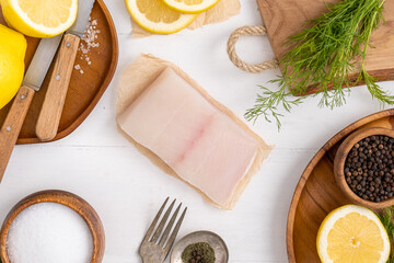 Freshly caught Alaskan Cod. Cod as a healthy dinner option. Fish recipe with dill and lemon.