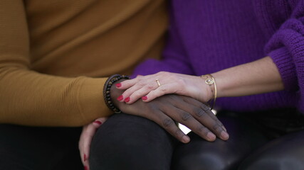Girlfriend hand caressing boyfriend. Interracial diverse couple, close-up hands
