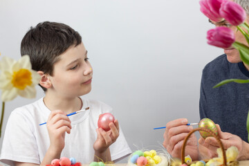Easter eggs. Happy Easter card. Multicolored Easter eggs. Easter. Easter eggs on a white wooden...