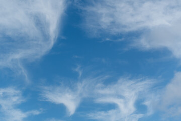 Blue sky and scattered clouds background - 417920084