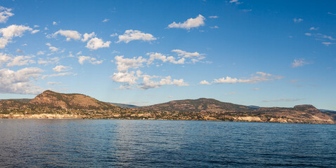 Panoramic view of idyllic summer landscape in the British Columbia with clear mountain lake background