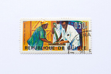  Guinea Republic Postage Stamp. circa 1967. reptilies stamp series. venom extraction