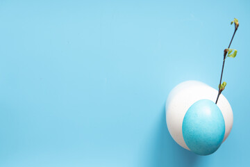 Easter eggs painted in pastel colors on blue background. Easter concept