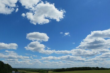 Obraz premium Landscape with clouds and field
