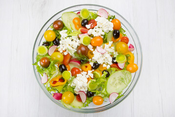 delicious mixed salad with cucumber,tomatoes,black olives and feta cheese