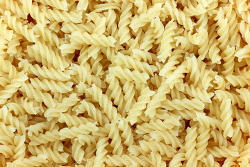 Close-up of raw  pasta, texture or background, spiral pasta