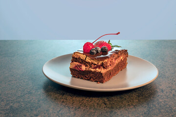 a piece of delicious homemade cake on a plate on a wooden kitchen table