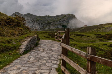 Picos de Europa, Spain, May 24, 2018: Mountain walkway in a mystical environment, overlooking the...