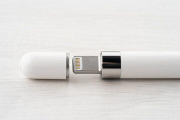Connector for charging tablet pen, on a light background