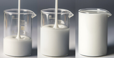 On the table there are 3 measuring glasses filled with a white dense liquid, milk or other viscous...
