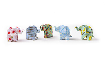 Closeup shot of colorful patterned origami elephants isolated on a white background