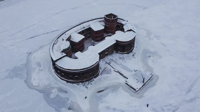 Defensive installations of the Fortress of Kronstadt. Forts of the Island Kotlin. Fort Alexander I in winter time aerial video.